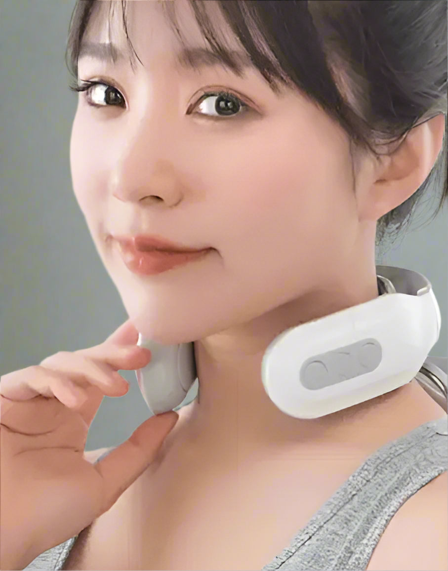 Person using a neck massager with a plain background